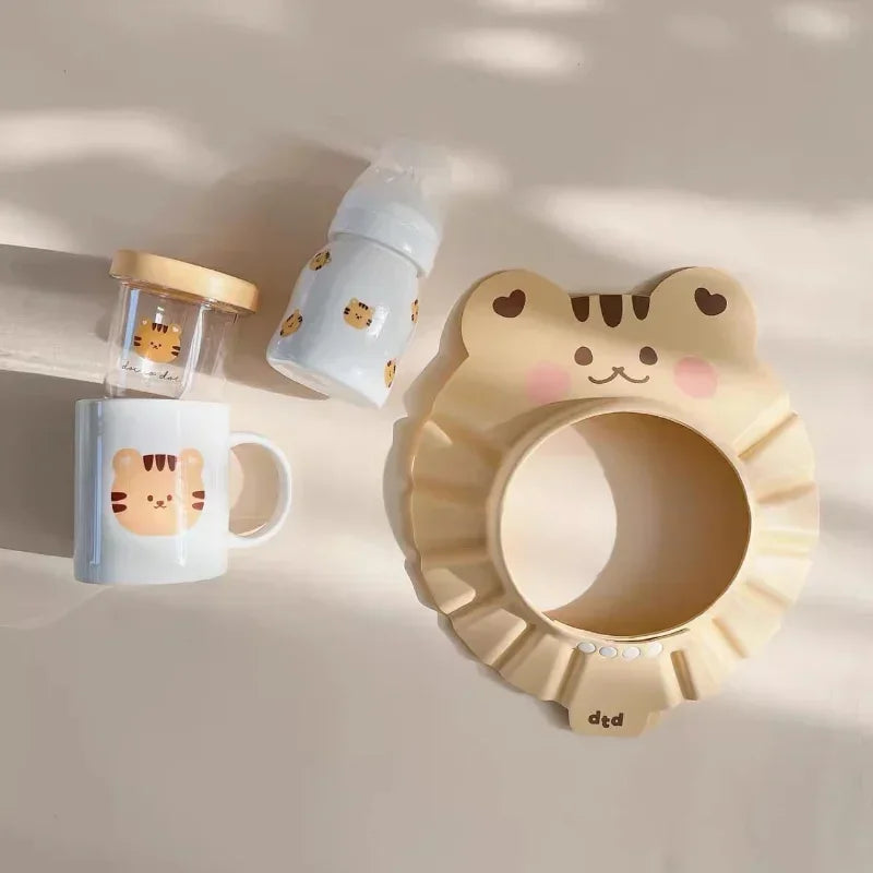 Bonnet de bain “Petits Animaux” – Protection réglable et anti-éclaboussures pour bébé